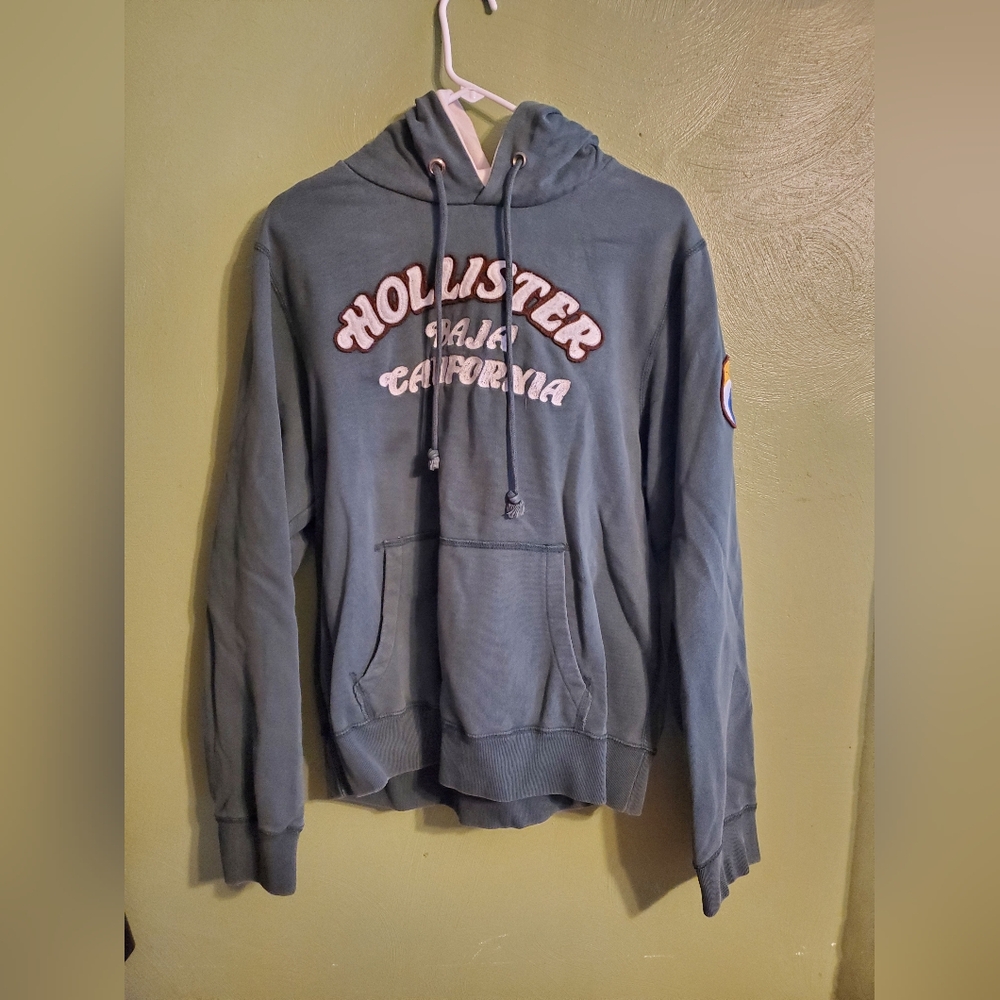This is a green hollister hoodie men's Large